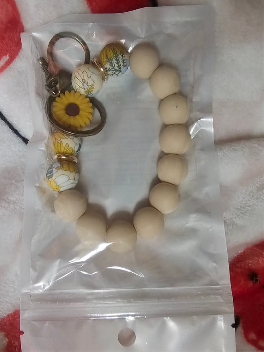 Tan flower wristlet