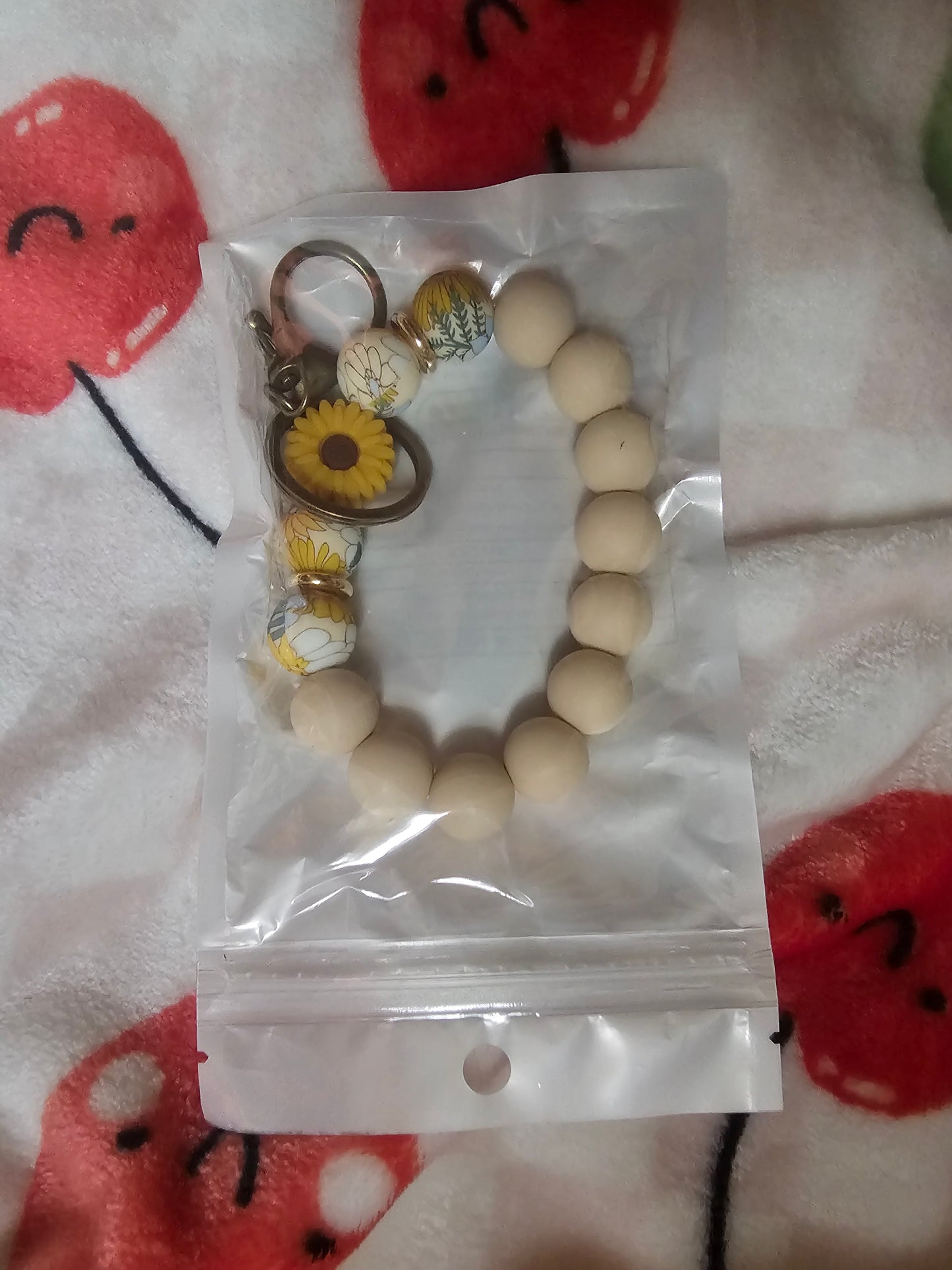 Tan flower wristlet